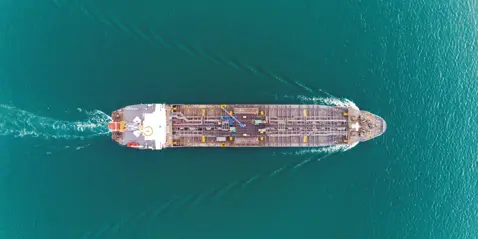 Aerial view of tanker ship sailing on turquoise water