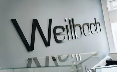 Weilbach logo on the wall in the reception at the head office in Lyngby, Denmark