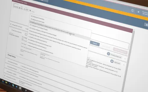 Sitting in front of a computer screen displaying digital logbook system
